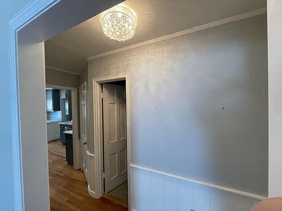 Hallway to bathroom and kitchen
