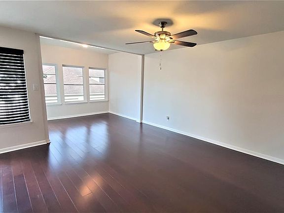 Very spacious living room that opens to this bright sunroom. NOTE: Engineered hardwood floors throughout.