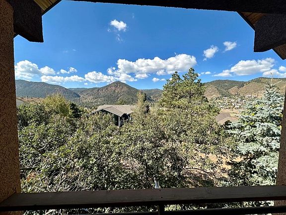 This is the view when you stand at the front door and look West. You see mountains and can barely see your neighbors!