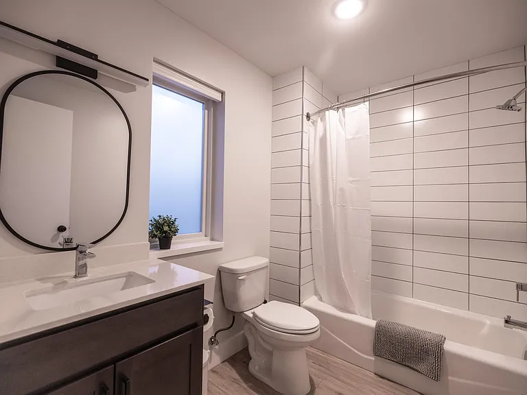 Bath tub + tile shower.