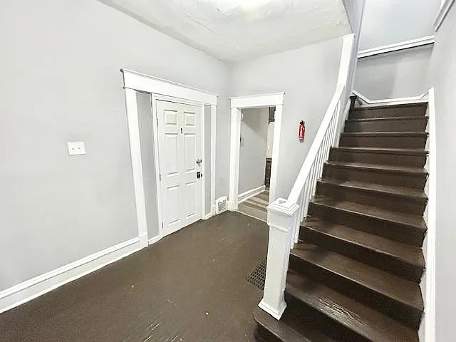 Welcoming entry foyer with stair access and convenient coat/gear drop space, connecting easily to nearby rooms.