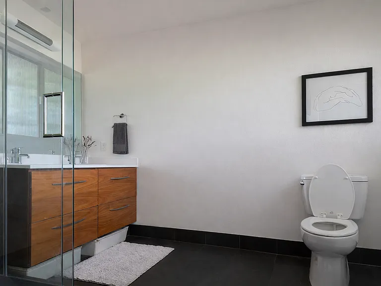 rainfall showerhead, double his/her sink, and heated ceramic floors