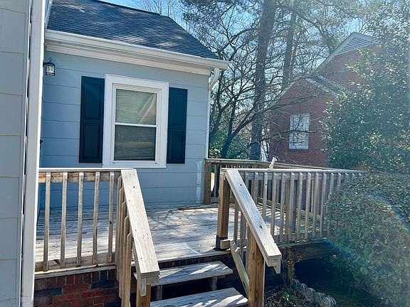 Attached deck with door access to house is perfect for grilling and enjoying the weather