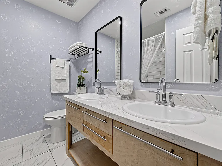 Full bathroom upstairs, double sinks with beautiful cabinetry.