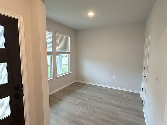 A study near the entry offers a quiet workspace for remote work or personal projects