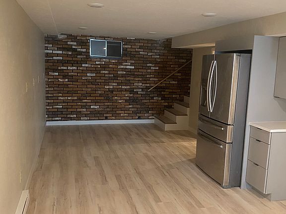 Living Room with brick accent wall.