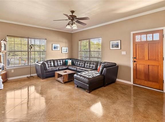 Open living area with low maintenance stained concrete floors