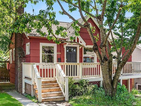 Front of the house. Beautiful bluebells and tulips bloom in