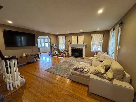 Large 19'x17' family room that flows into the dining room - for reference, the picture is showing a very large 75" TV.