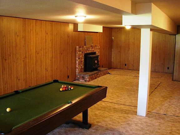 Big downstairs game room with wood burning insert