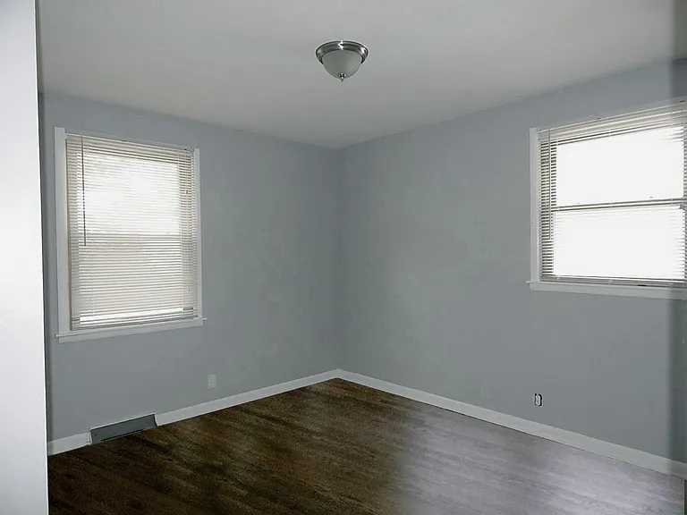 Bedroom #2 with 2 windows and closet.