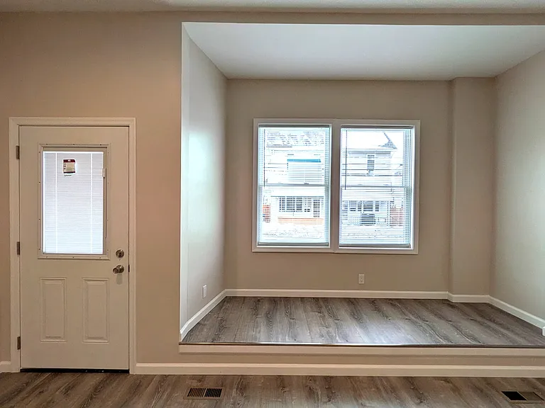 Spacious living room with an architectural alcove that you can watch the world go by from