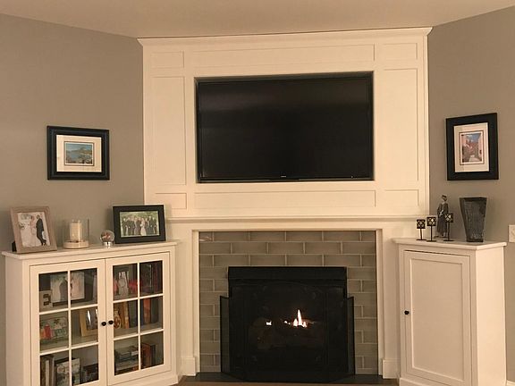 Gas fireplace in living room with custom wall unit