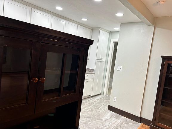 From living area into kitchen and bathroom