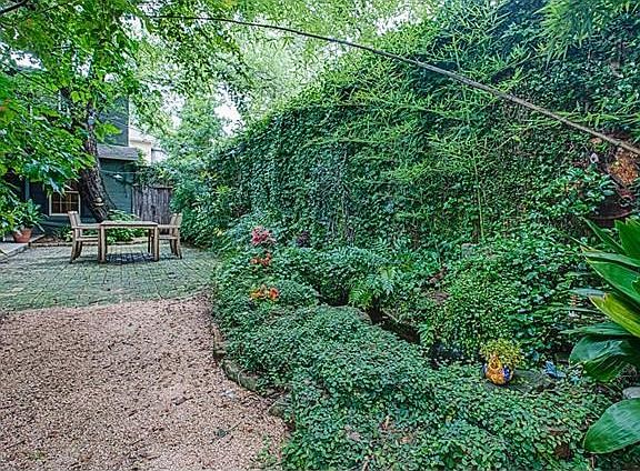 Koi pond does convey!  such a tranquil treat to hear the running water while you are out in your courtyard enjoying your beverage of choice.  Courtyard is so large that there is room for a pool or playscape.