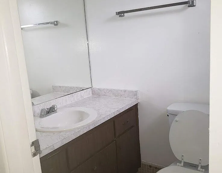 1/2 Bath attached to back Bedroom