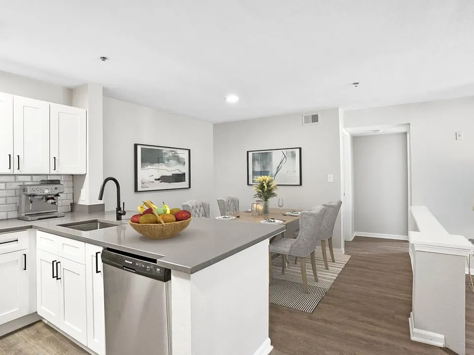 Open concept kitchen with stainless steel appliances at The Crossings at Russett in Laurel, MD