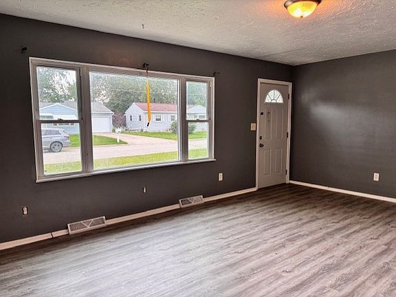 Living room with BRAND NEW LVT wood plank flooring.