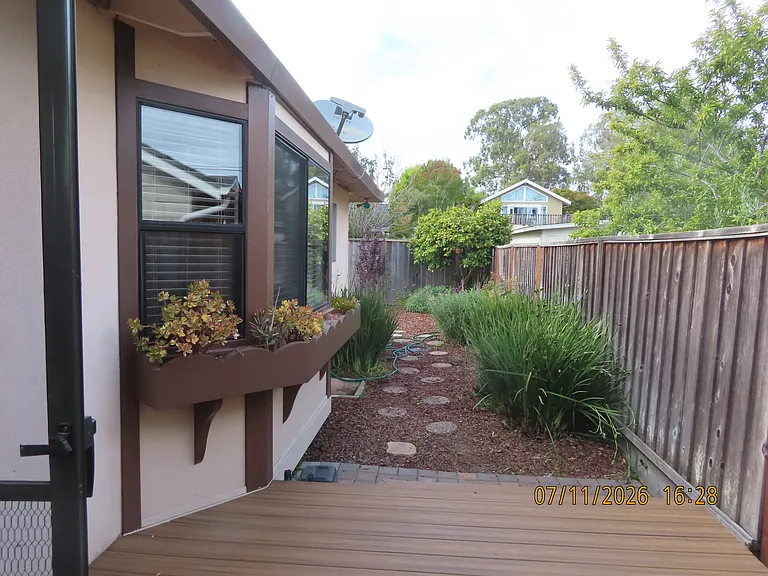Right side rear yard from front.