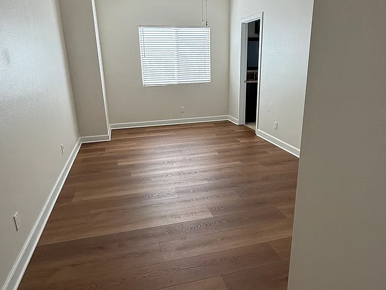Bedroom Upstairs (Jack & Jill) with laminate wood flooring and connected bathroom