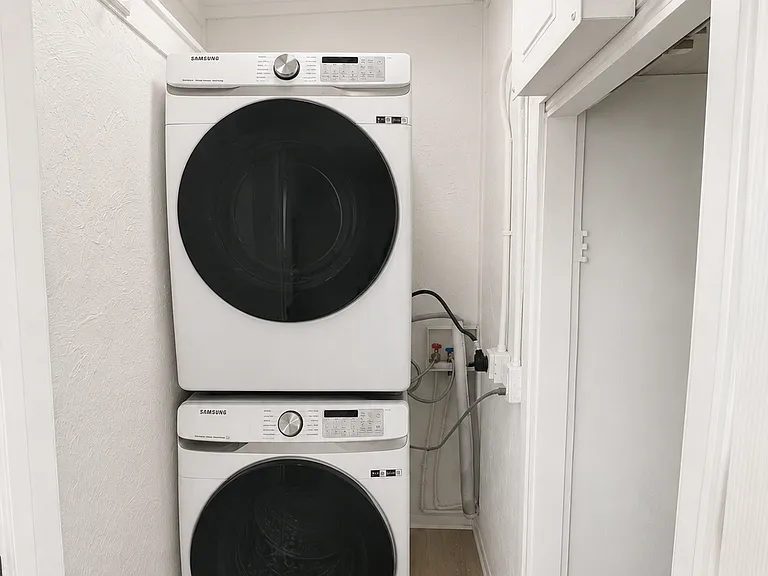 Convenient in-unit stacked washer and dryer tucked away for easy everyday use.