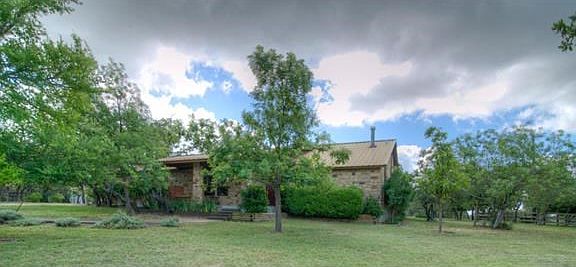 The home sits back from the road and has plenty of space between neighbors.