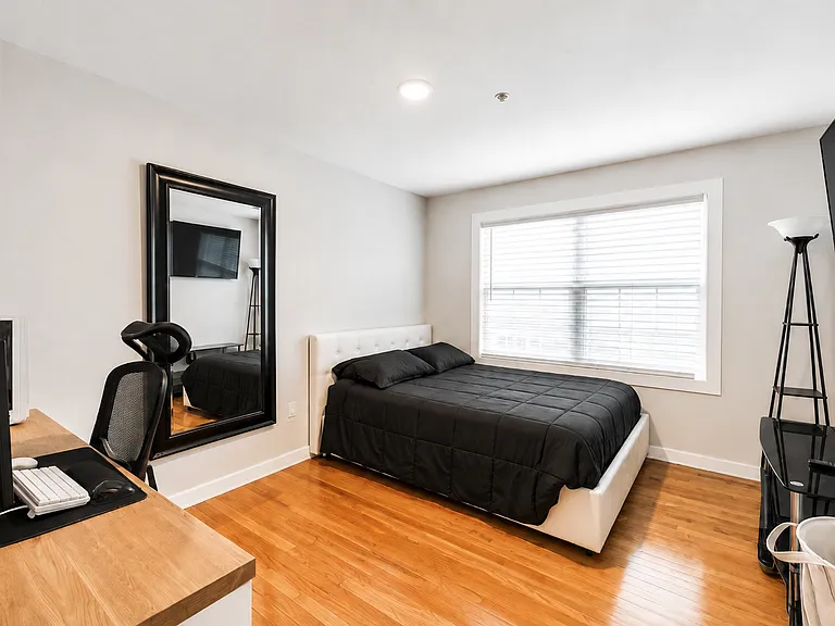 Spacious bedroom with room for a home office or work-from-home setup