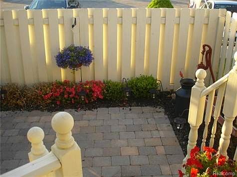 PRIVATE COURT YARD WITH NEW BRICK PAVERS