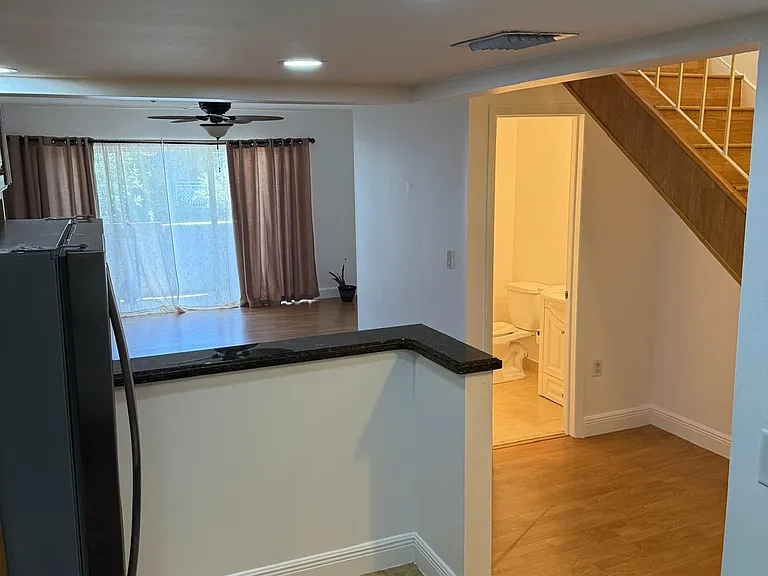 Kitchen looking into half bath
