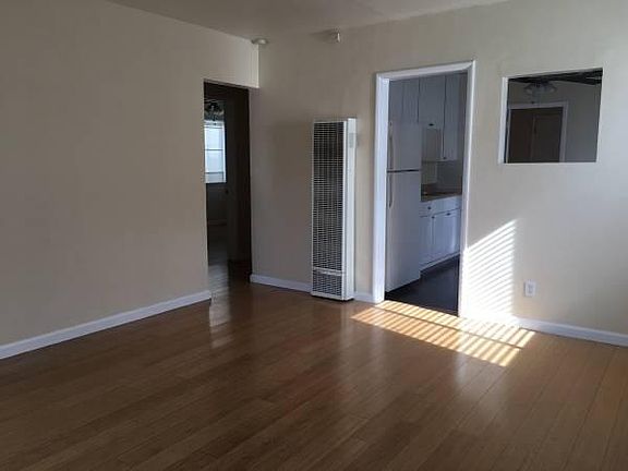 Livingroom and view of kitchen & bedrooms