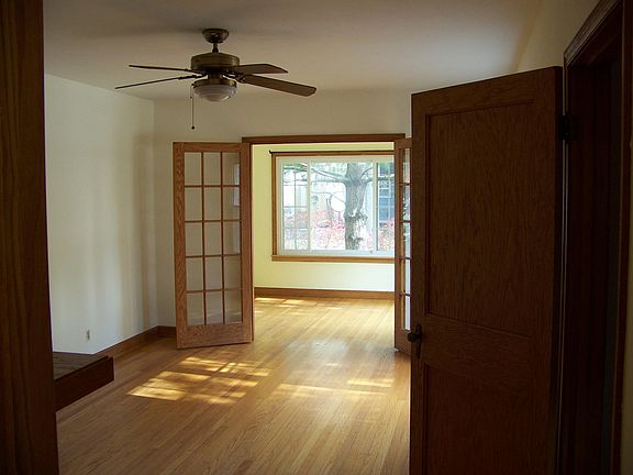 Living room with French doors leading to the office.