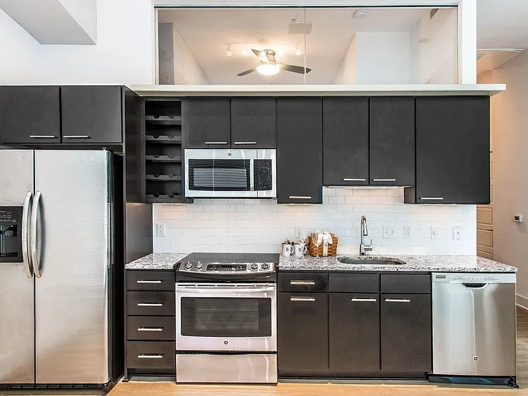 Kitchen with granite countertops and stainless steel appliances