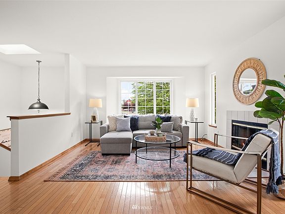 Split level home faces north with skylight over the entryway to main and lower levels.