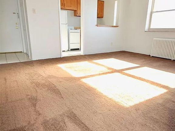 Living room with AC and Fan.