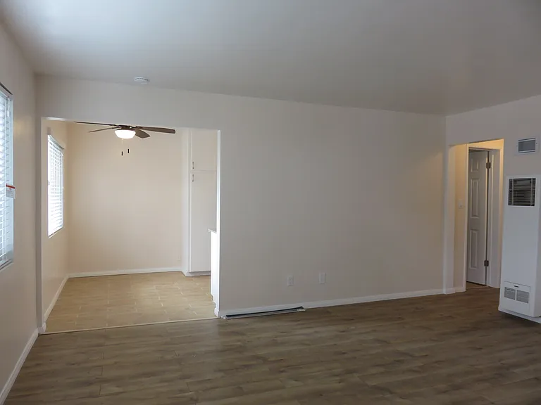 living room and kitchen area. View from door entrance