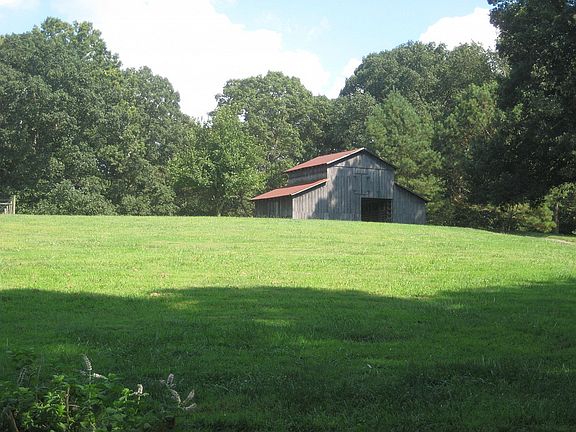 Restored vintage barn sits beautifully behind the house, it is totally functional with new electric wiring, a horse lovers dream!