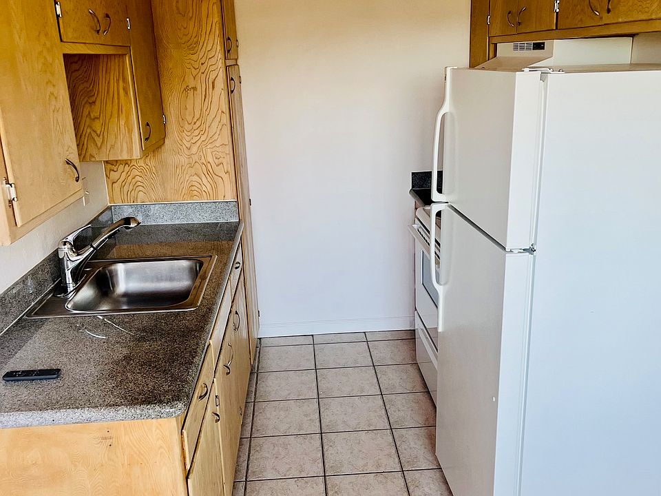 kitchen with original mid-century cabinets--newly refurbished blond finish