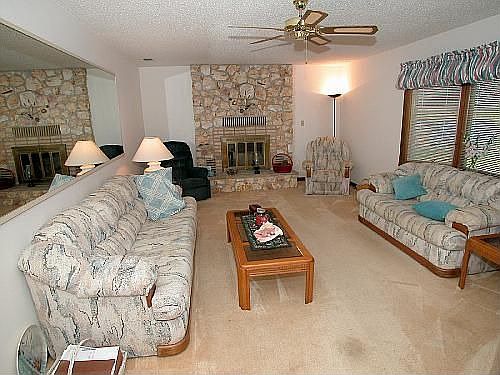 living room w/wood buring fireplace