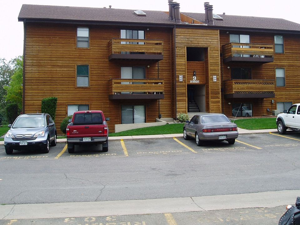 Front view of building with reserved parking space on left side.