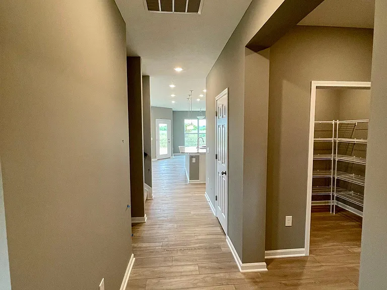 Foyer and Overflow Pantry near Garage Entrance door