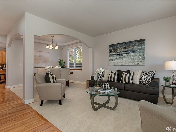 Gorgeous, timeless hardwood floors grace the entrance and continue through the kitchen and eating space! 