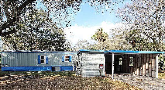 Front with storage andcarport