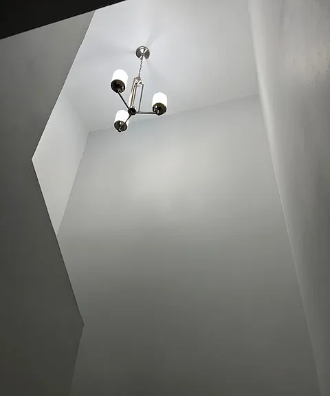 Stairwell, Brand New Tile and Grout, New Baseboard and Molding, Handrails, Chandelier Light. Freshly Painted Ceiling, Walls, New Baseboards and New Moldings.