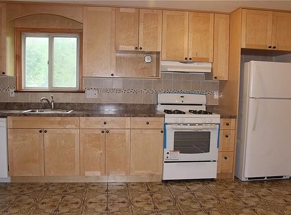 Updated eat-in-kitchen. New appliances, cabinets and counte