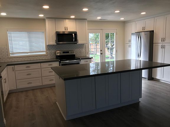 Kitchen features plenty of white shaker cabinets, quartz countertop, brand new Stainless steel appliances