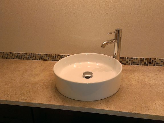 solid tarvertine top and granite counters in kitchen