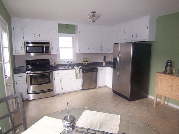 Kitchen with New Ceramic Tile and Stainless Appliances