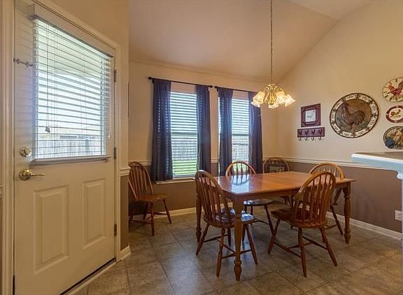 Bright open dining room with added chair rail.