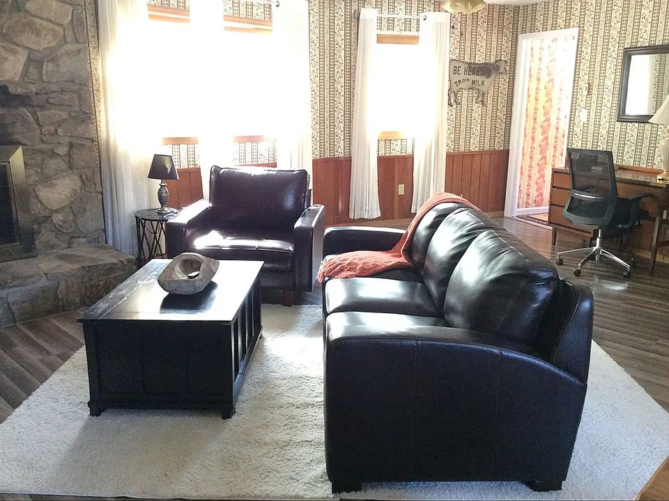 Comfortable and spacious living room with large storage closet.