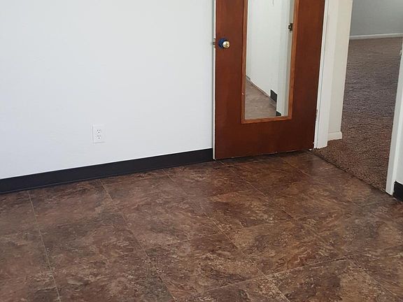 Bedroom 1 with new vinyl floor 11X15